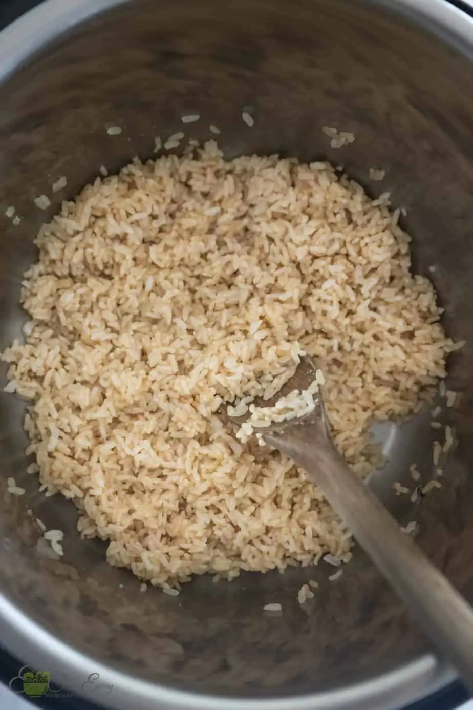 fully cooked brown rice in the instant pot. fluffed with a Wooden spoon