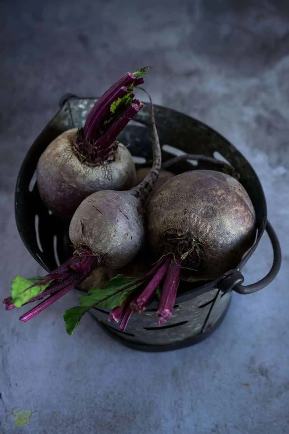 Raw beets in a metal basket