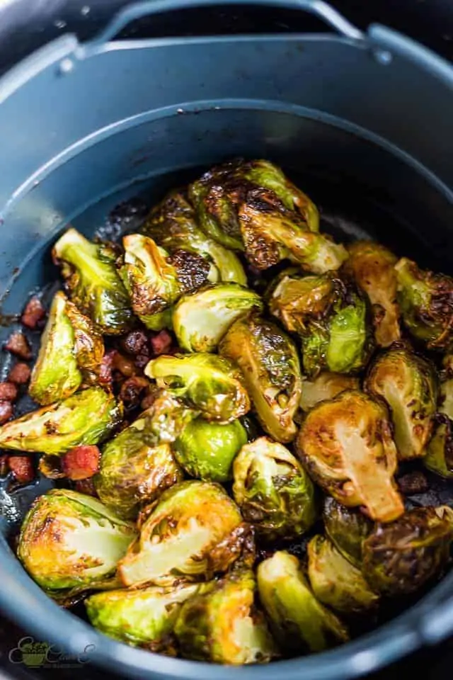 air fryer Brussels sprouts in the basket of the instant pot air fryer lid with pancetta
