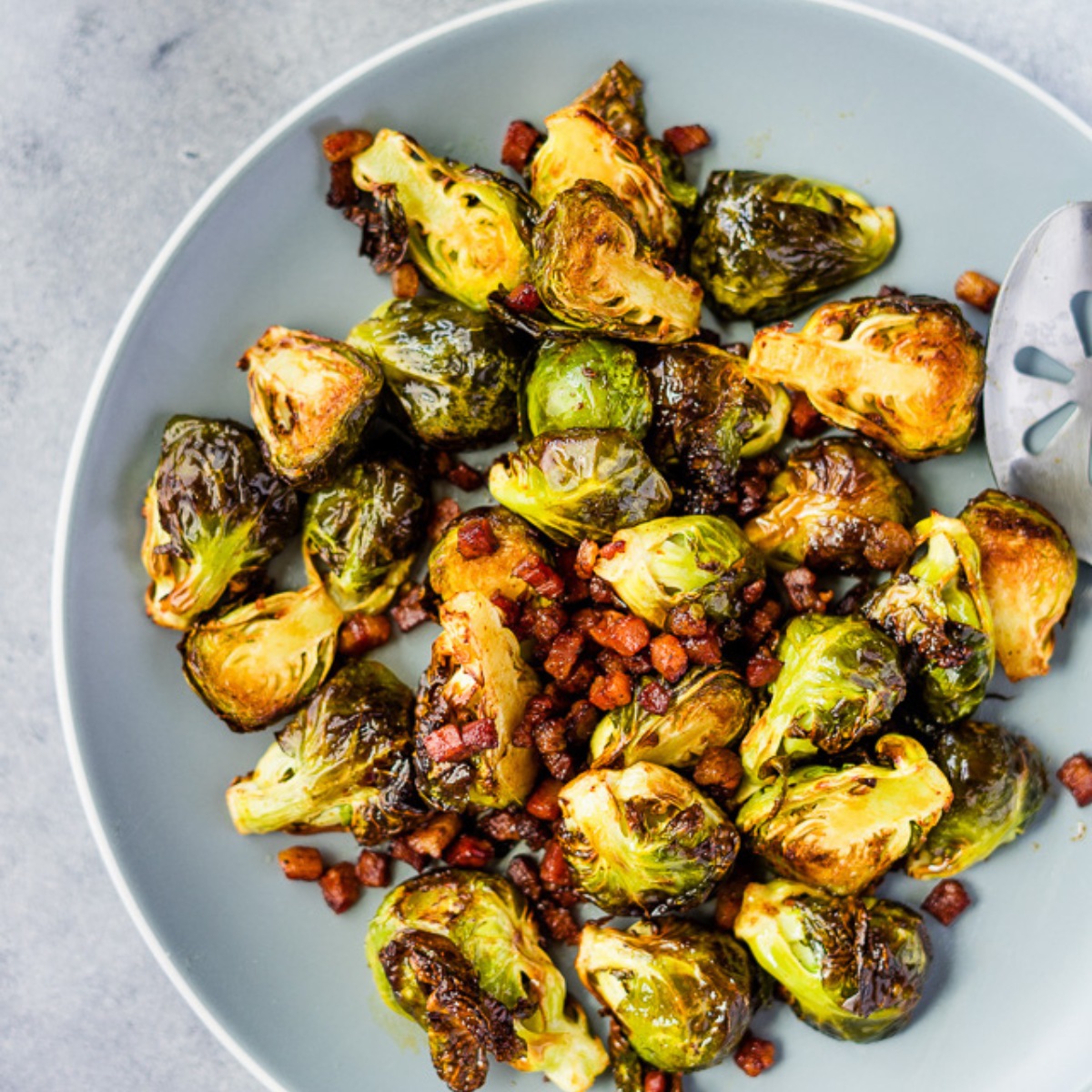 air fryer brussels sprouts with pancetta on a plate.
