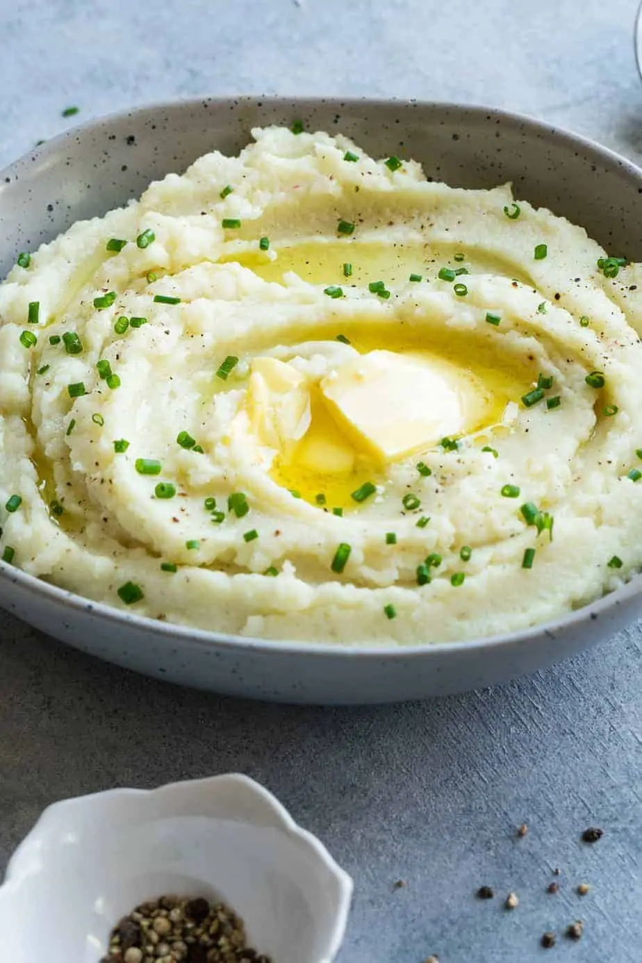 cauliflower mash instant pot with peppercorn and chives plus extra butter.