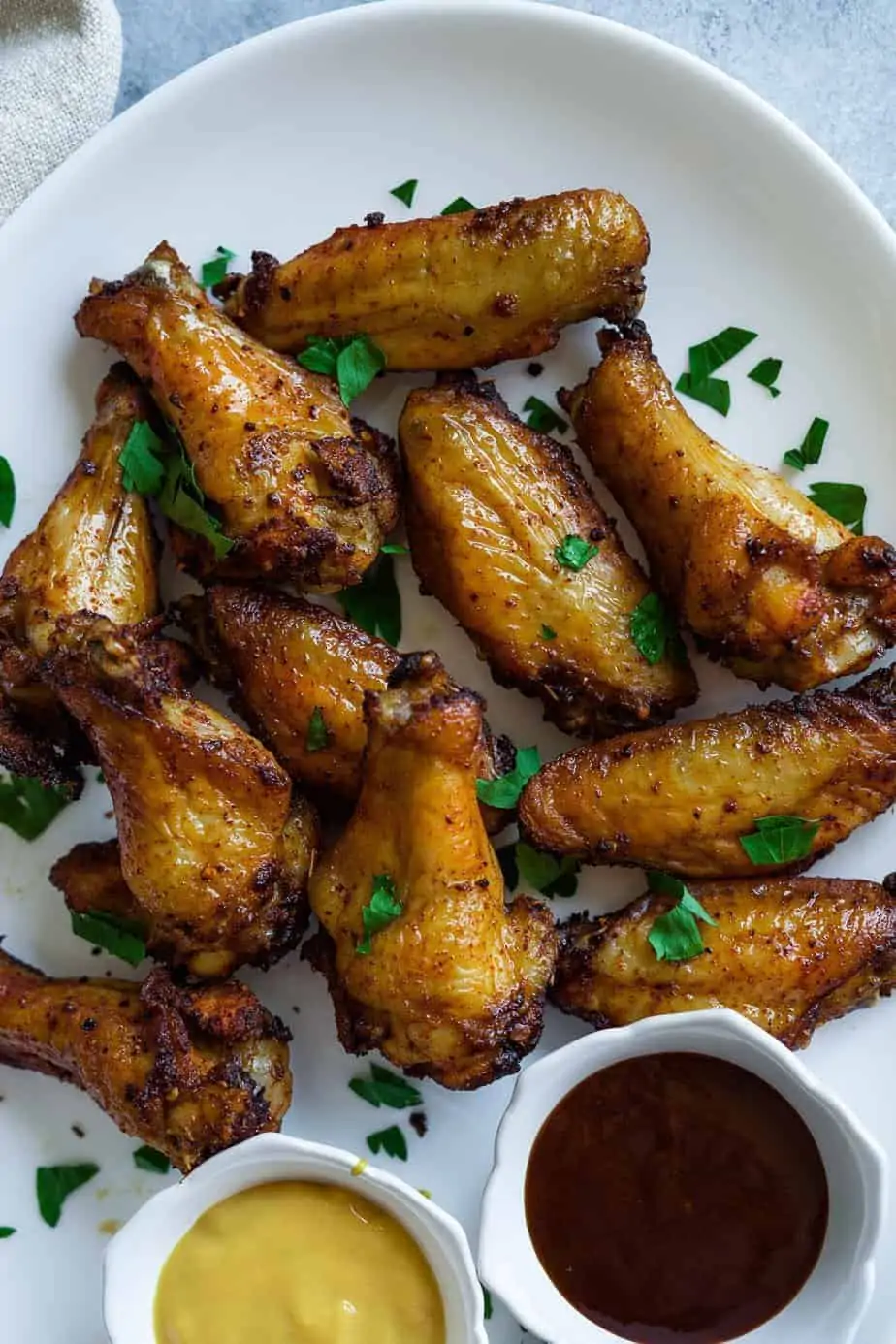Crispy instant pot air fryer lid chicken wings. serve with dipping bbq sauce.