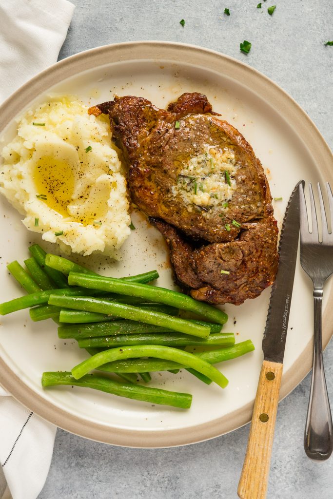 Juicy meat cook to perfection and serve with sides of mashed cauliflower and steamed green beans