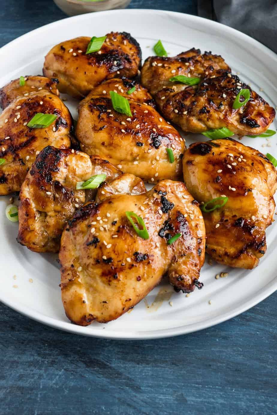 juicy chicken thighs sprinkle with green onion