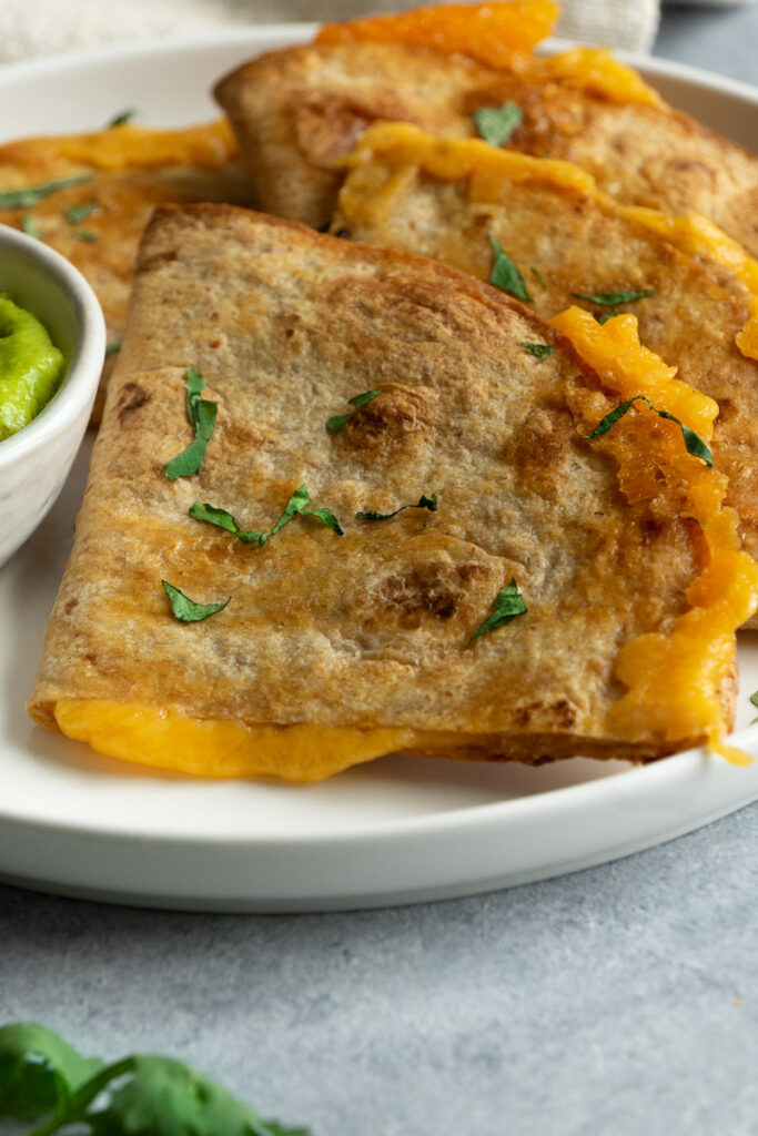 cheese quesadillas in air fryer sprinkle with fresh cilantro and serve with guacamole.