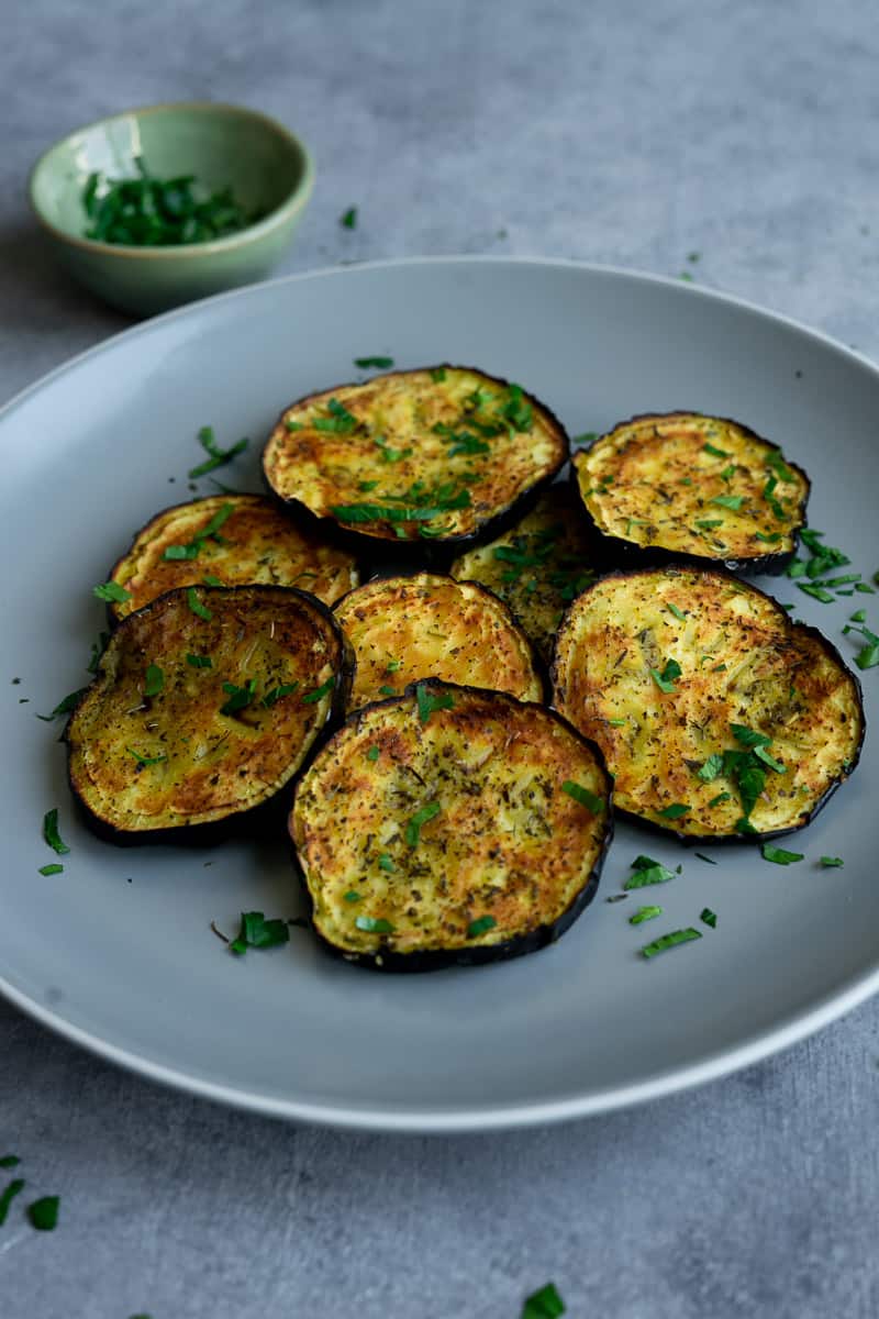 crispy eggplant made in the air fryer and garnish with parsley.