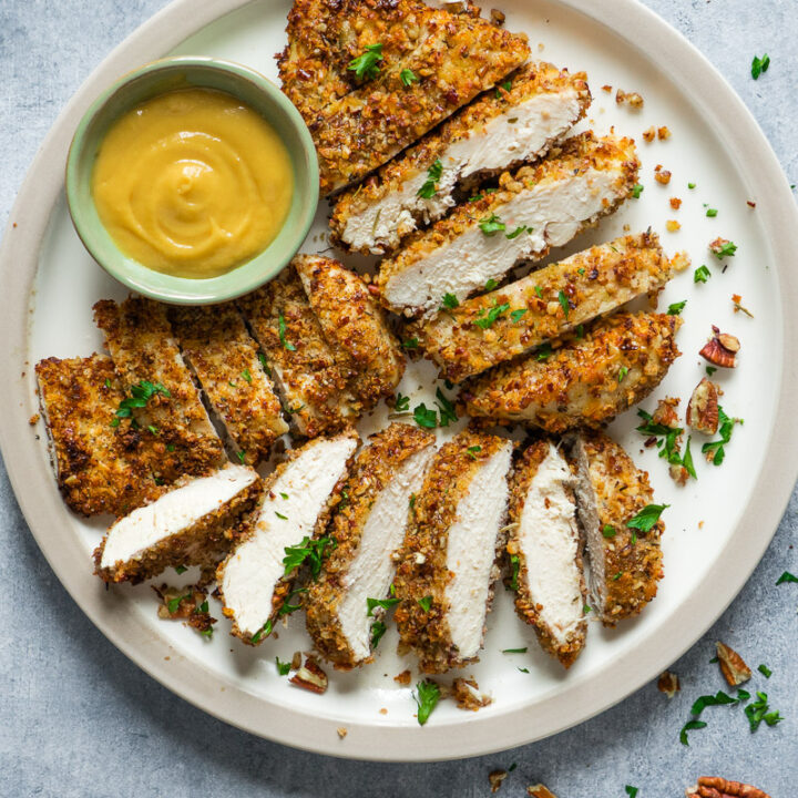 Air fryer pecan crusted chicken breast swerve with honey mustard sauce.