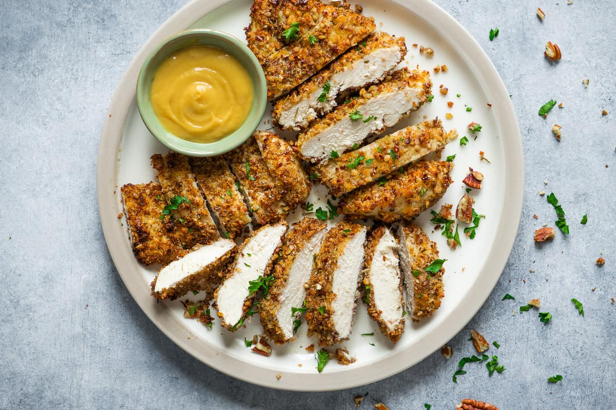 Air fryer pecan crusted chicken breast swerve with honey mustard  sauce.