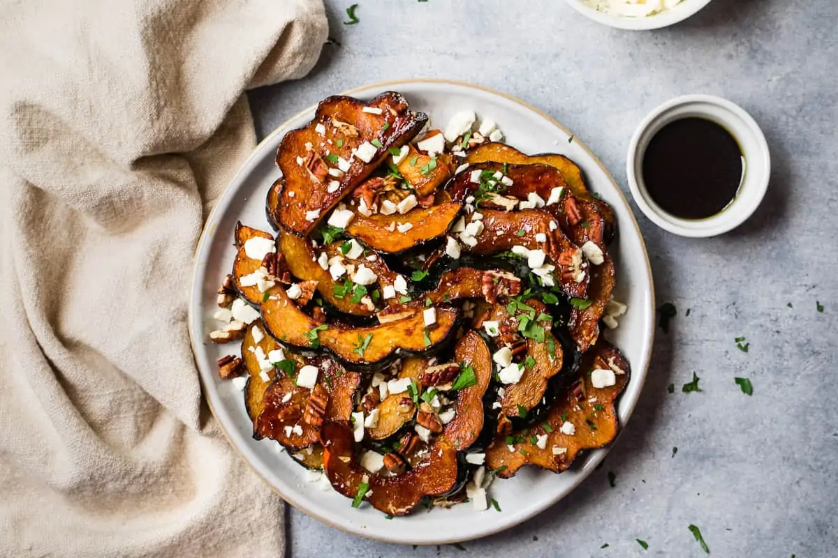 Air fryer acorn squash, top with feta cheese and dipping sauce.