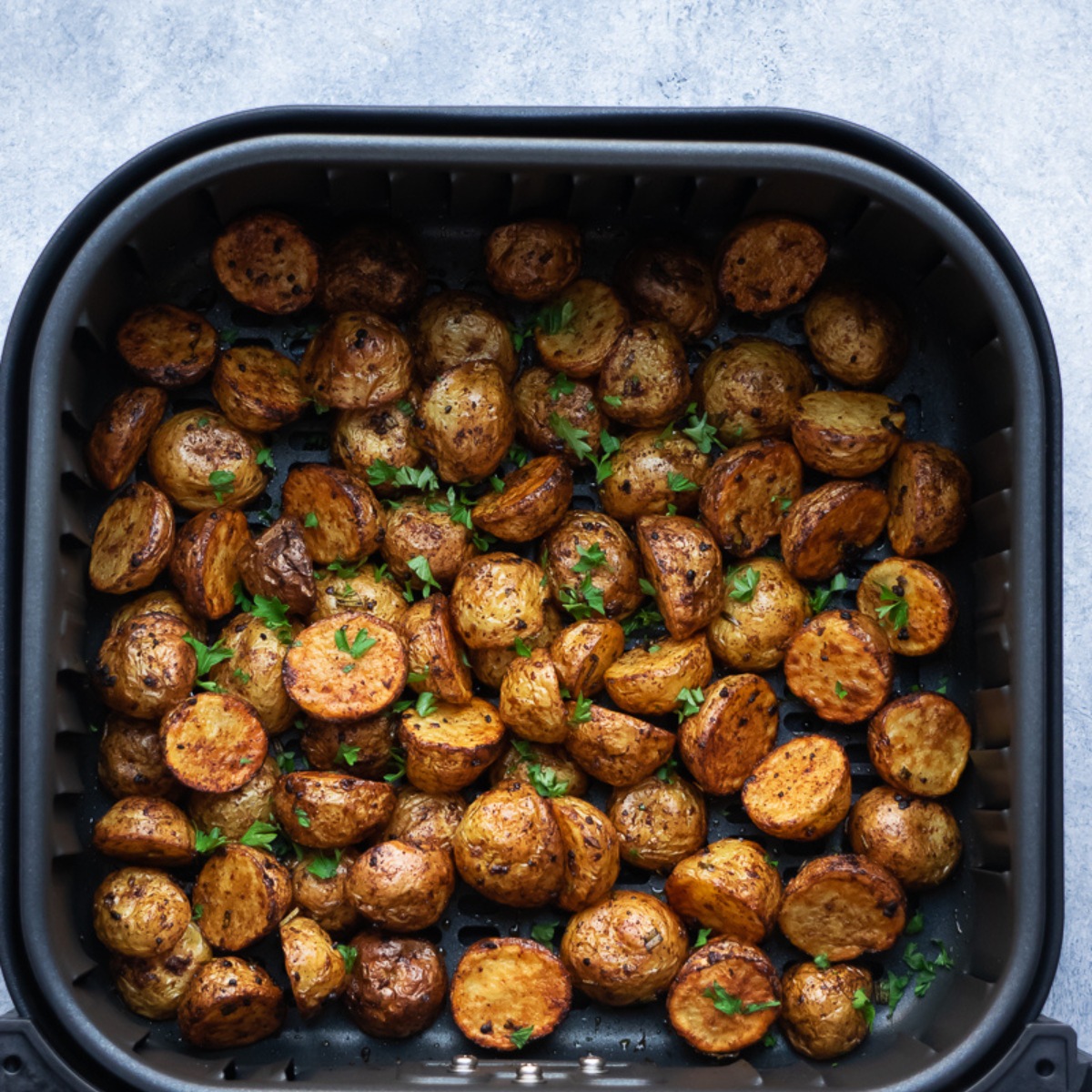 air fryer baby potatoes sprinkle with parsley.