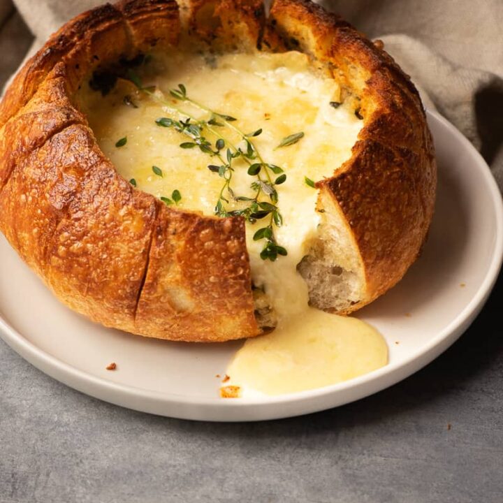 air fryer brie cheese melted in a bread bowl.