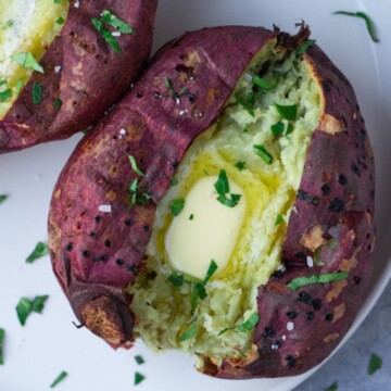 air fryer japanese sweet potato on a plate with melting butter.