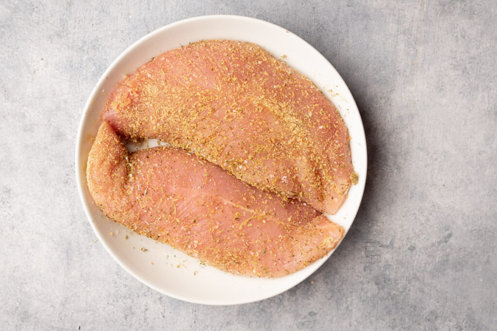 rub the seasoning on the turkey tenderloin before wrapping with bacon.