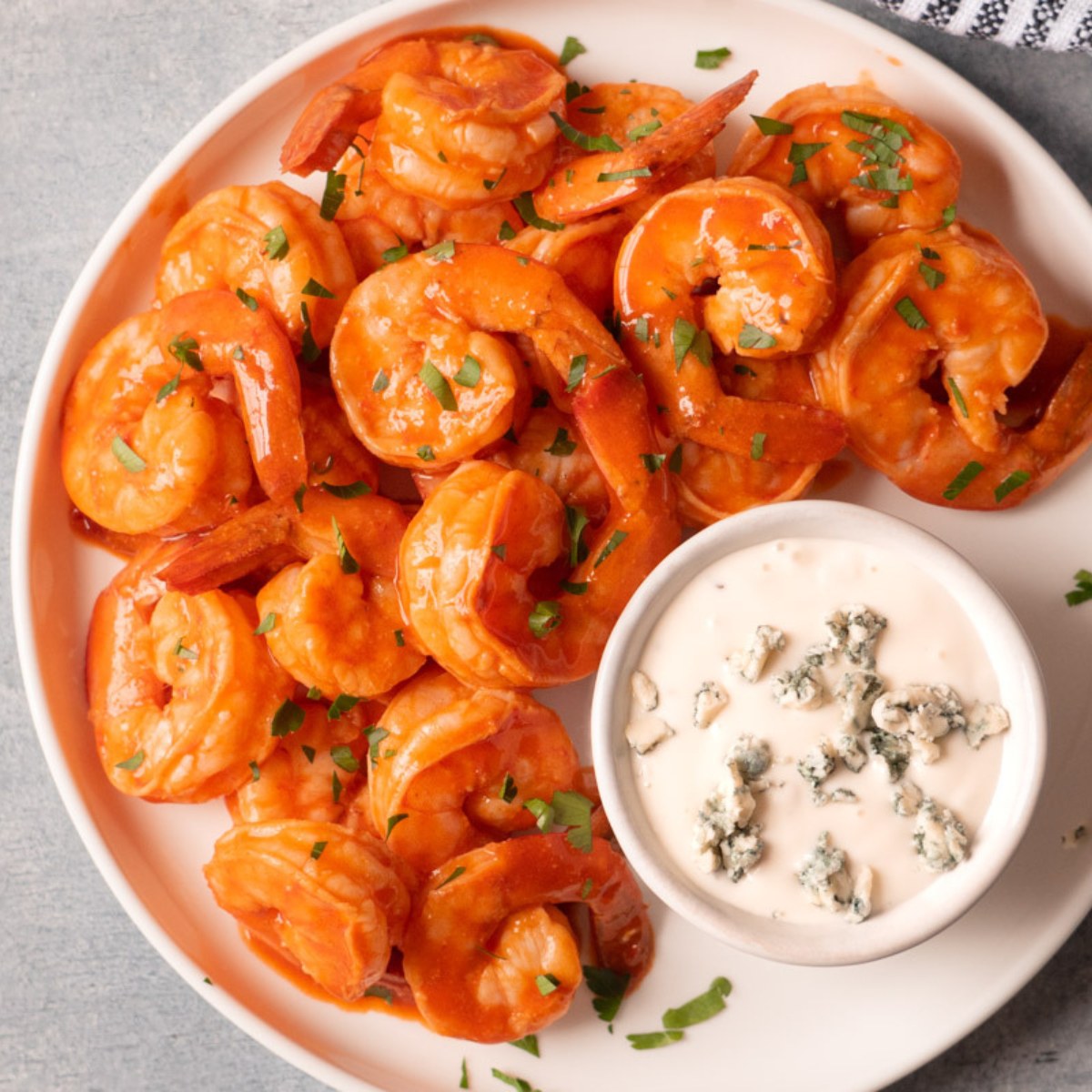 Air fryer buffalo shrimp served with blue cheese dipping sauce