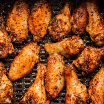 air fryer chicken wings in the basket.