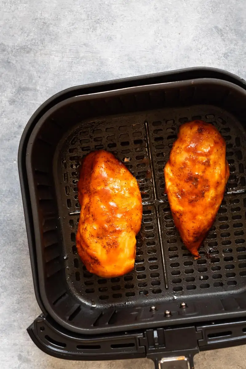 Cooked chicken breasts in the air fryer.