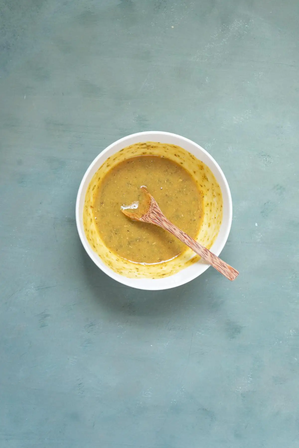 Dijon mustard, honey, and dried oregano in a small bowl.