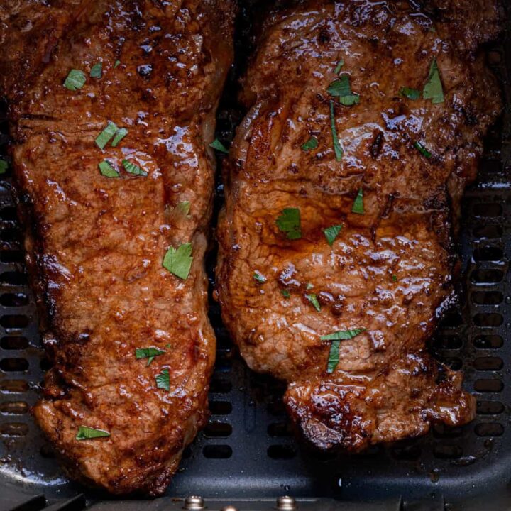 Air Fryer New York Strip Steak, garnish with fresh parsley.