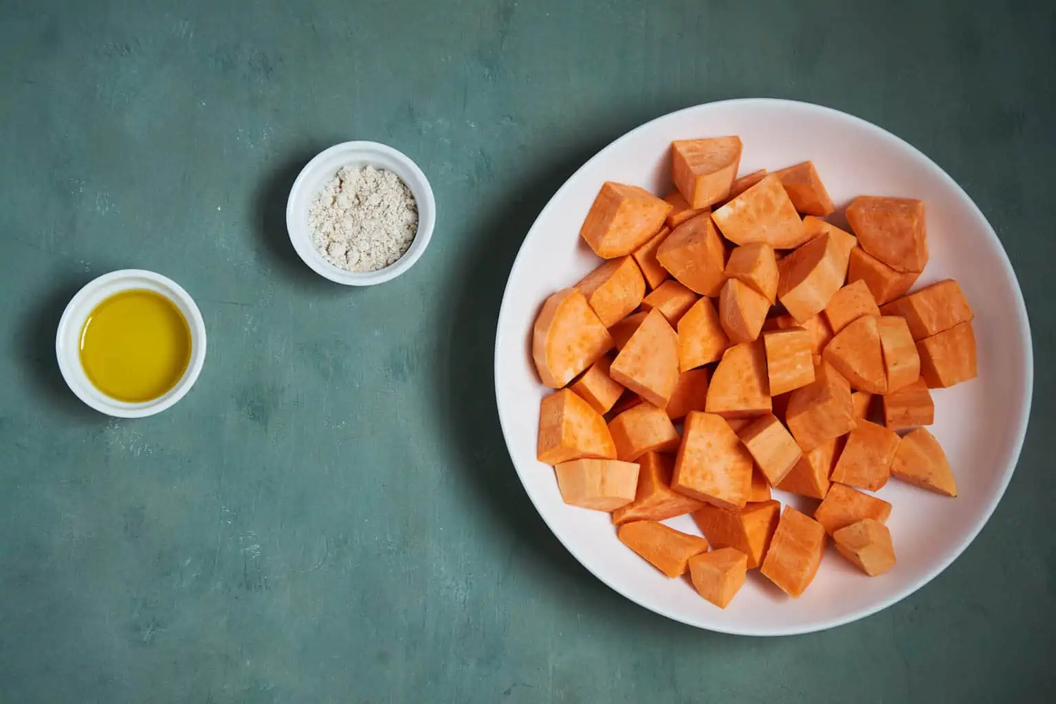 Ingredients to make roasted sweet potatoes in air fryer.