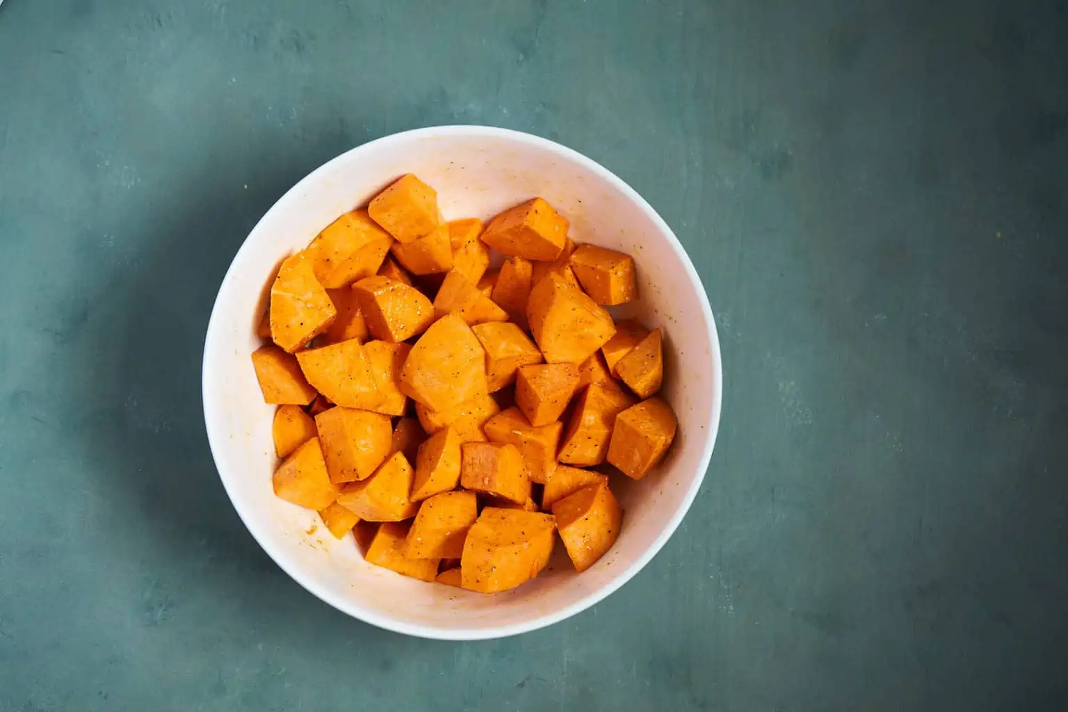 Chunks of sweet potatoes with oil and onion soup seasoning mix.