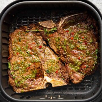 air fryer t-bone steak with chimichuri sauce.