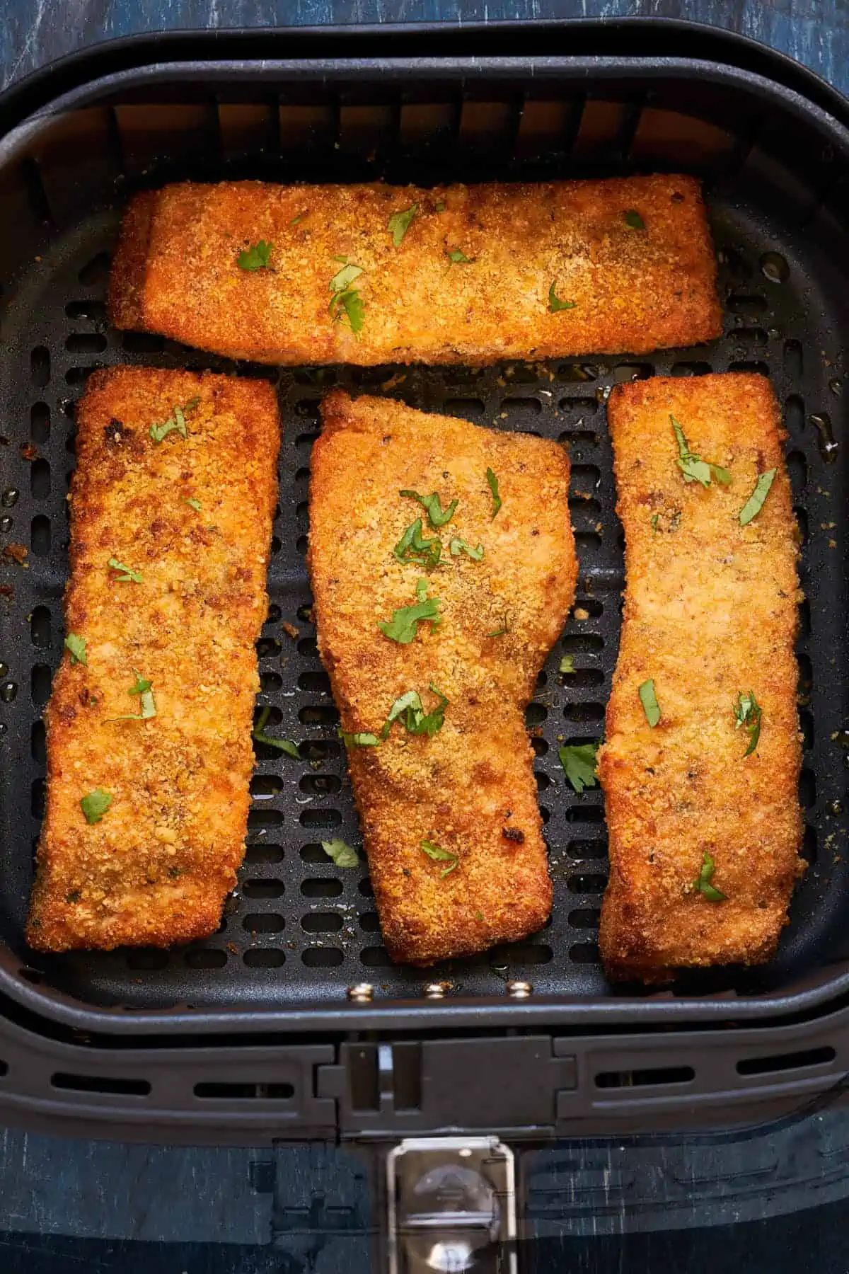 Crispy crust breaded salmon sprinkle with fresh herbs.
