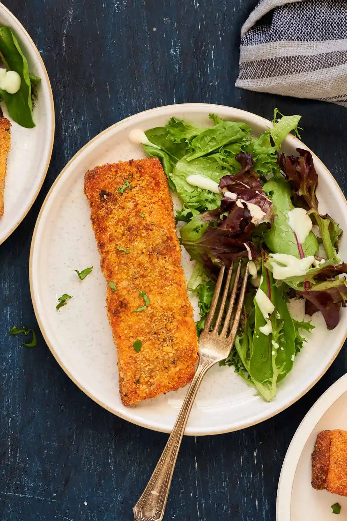 Air Fryer breaded salmon serve with a green salad.