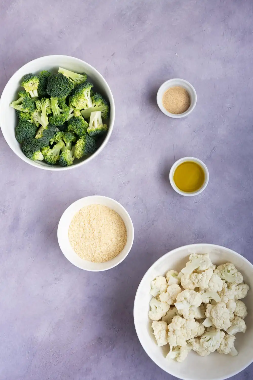 Ingredients to make broccoli and cauliflower with parmesan cheese.