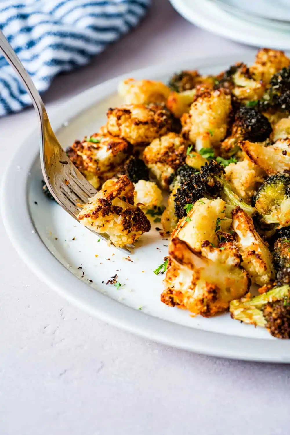 Air fryer broccoli and cauliflower served on a plate.