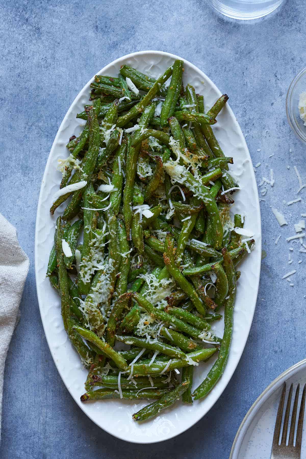 Vegetable side dish with parmesan on a plate.