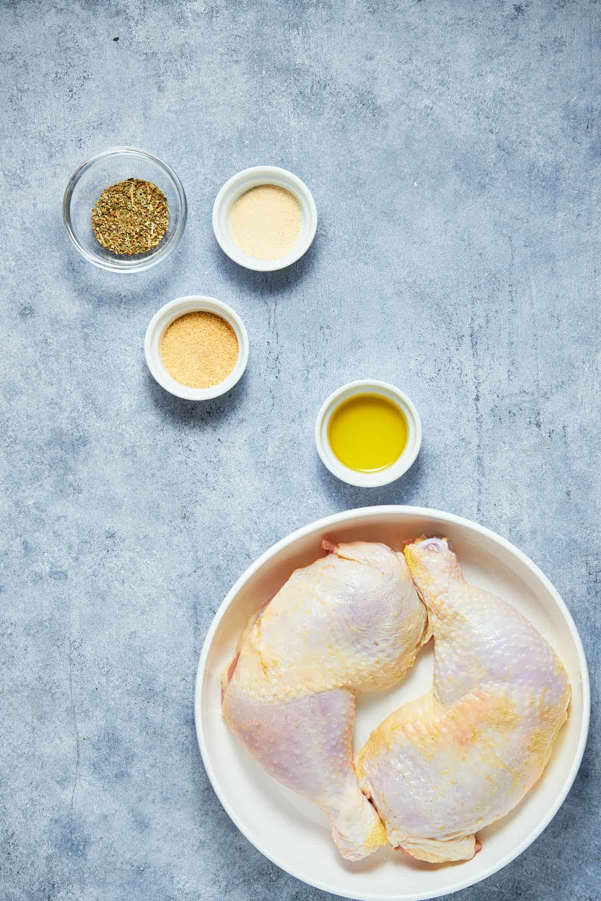 Ingredients to make chicken legs quarter ready to start cooking.
