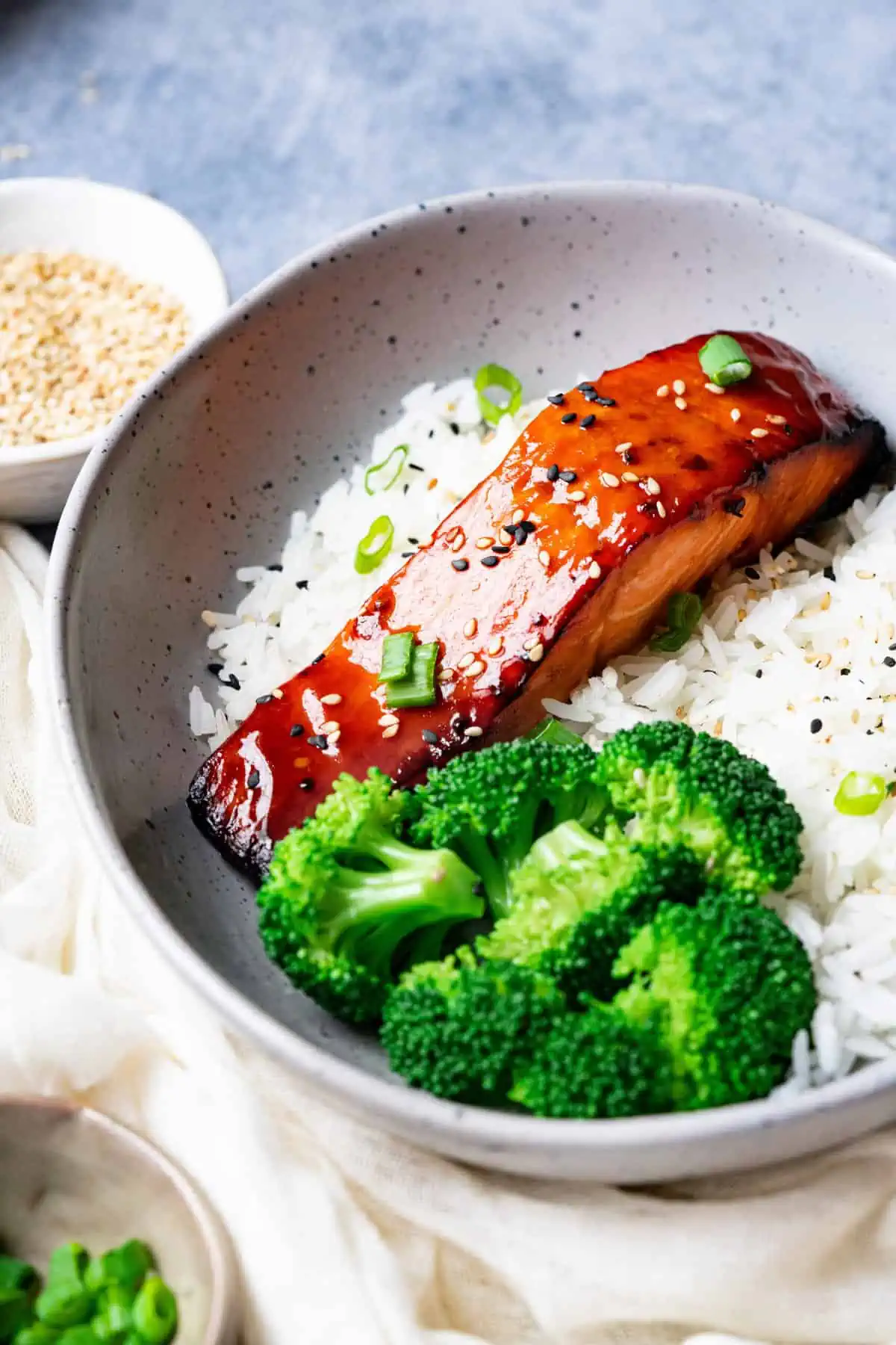 Teriyaki fish with broccoli and rice.