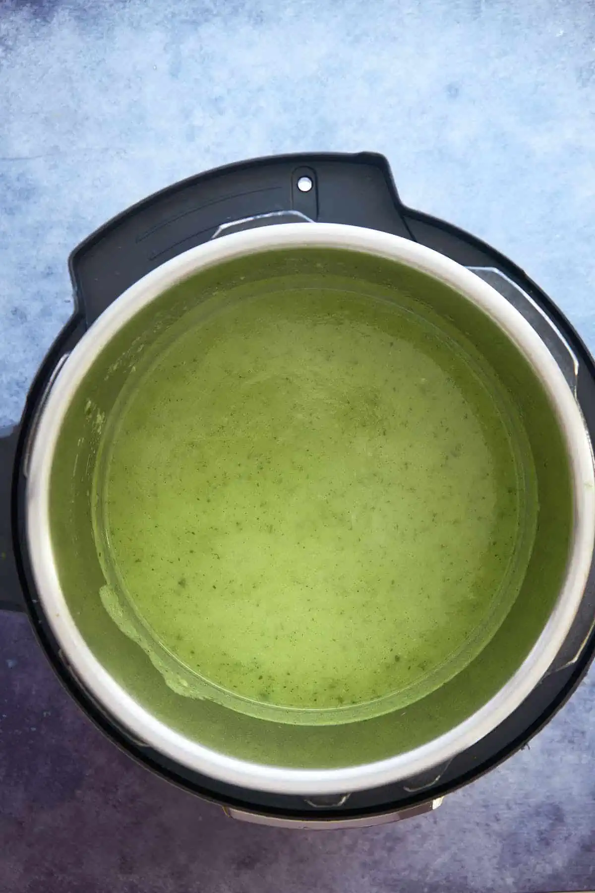 After blending the zucchini soup recipe and making the soup creamy inside the air fryer basket.