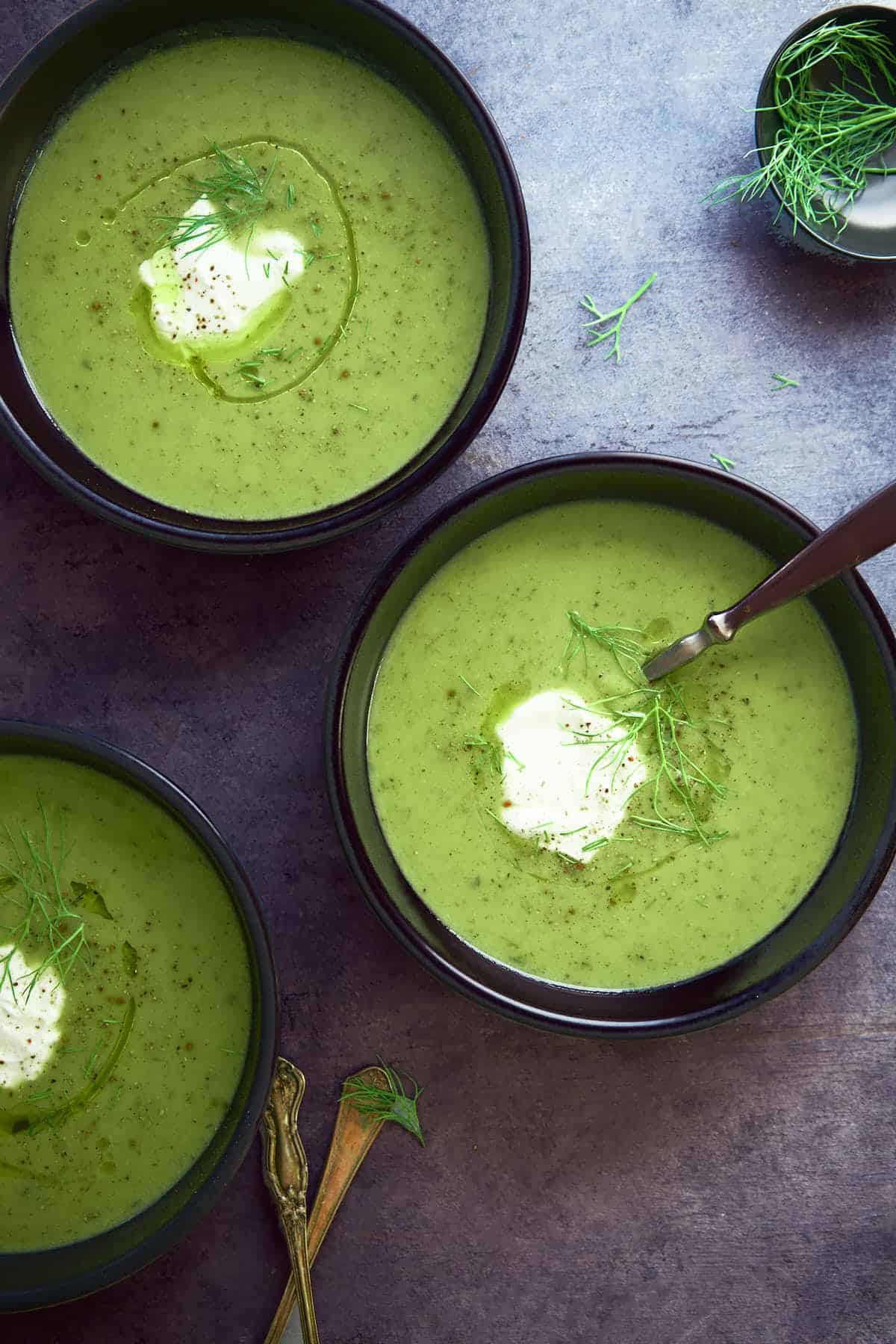 Instant pot zucchini soup served with yogurt and fresh dill.