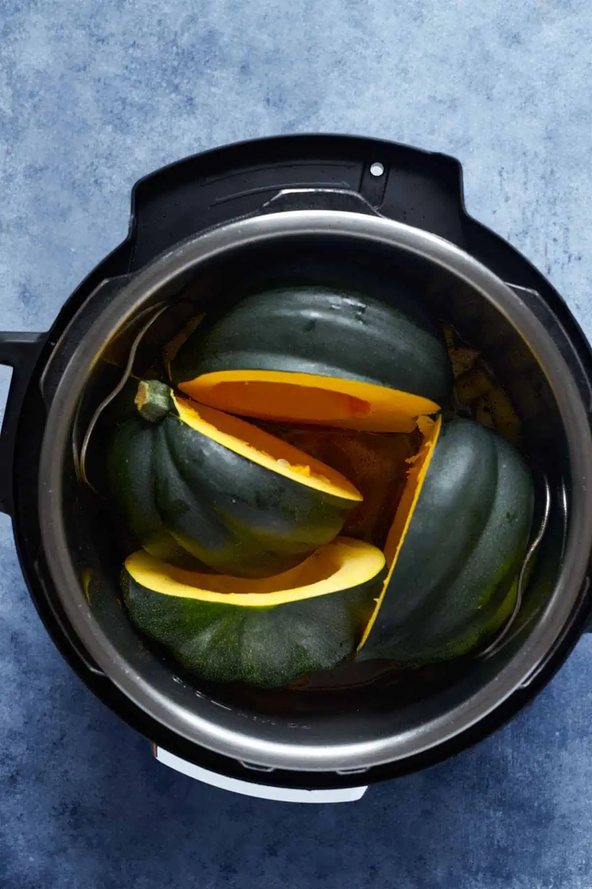 Before cooking the acorn squash in the instant pot