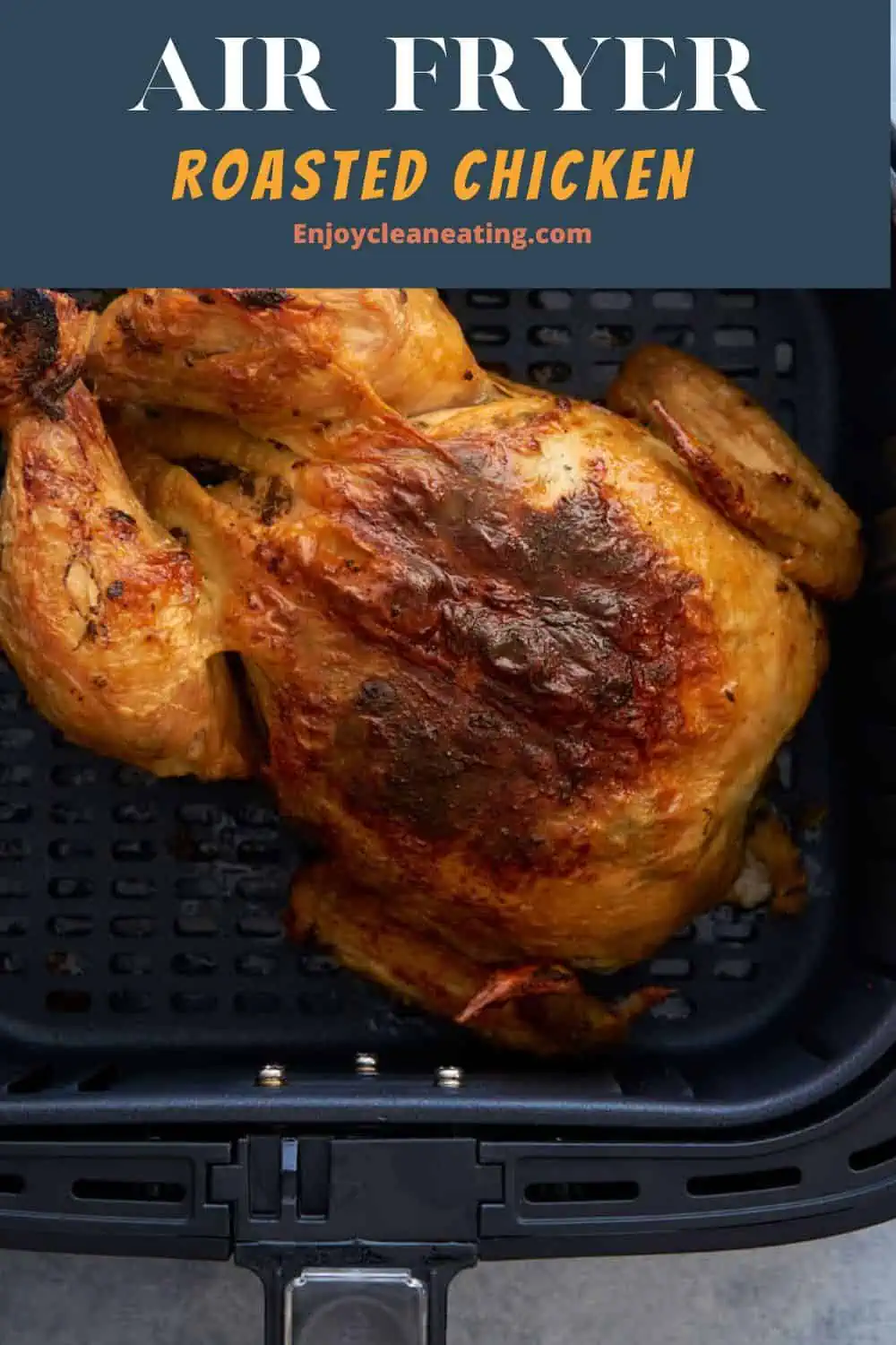 In the air fryer basket a roasted chicken.
