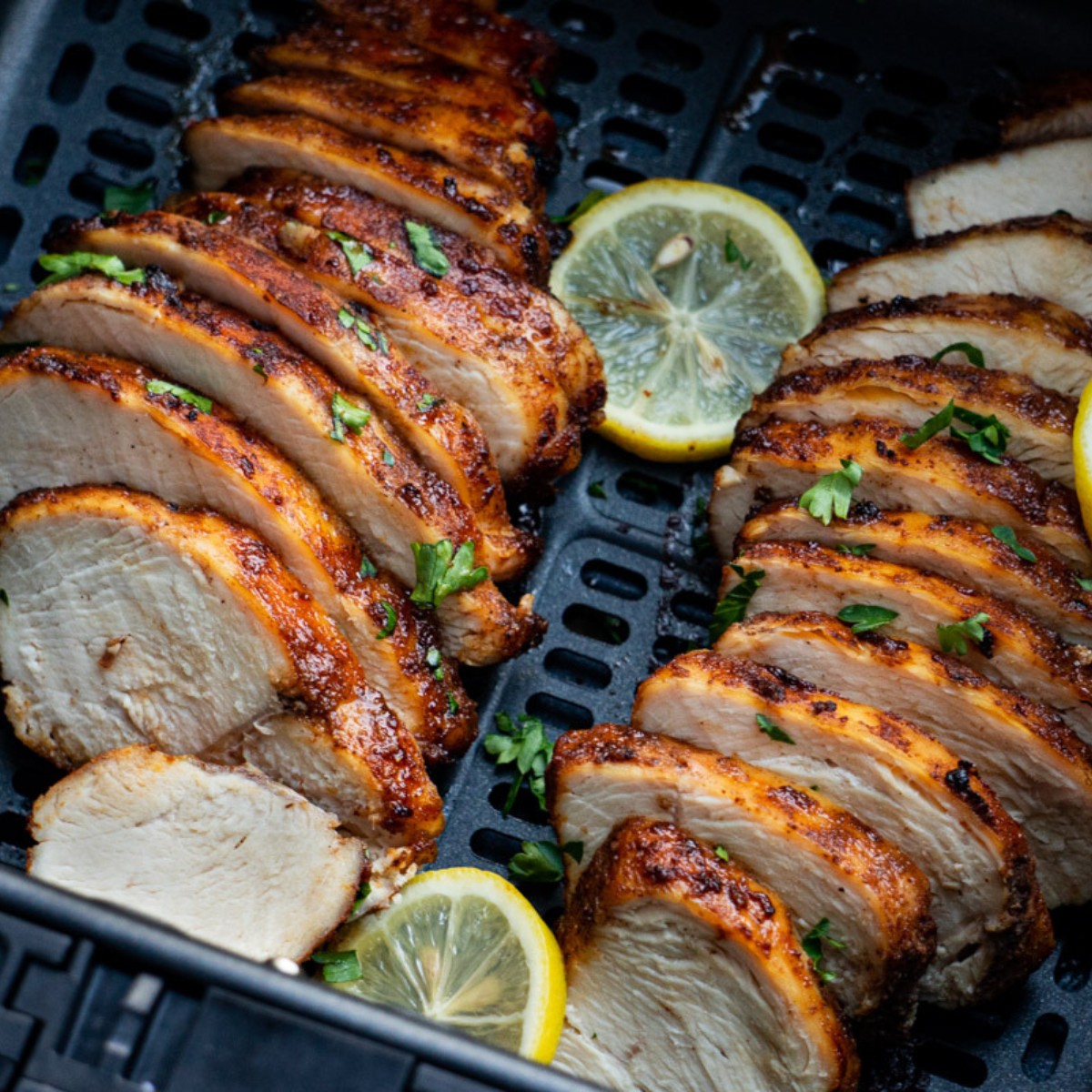 sliced thin chicken breast after cooking in the air fryer.