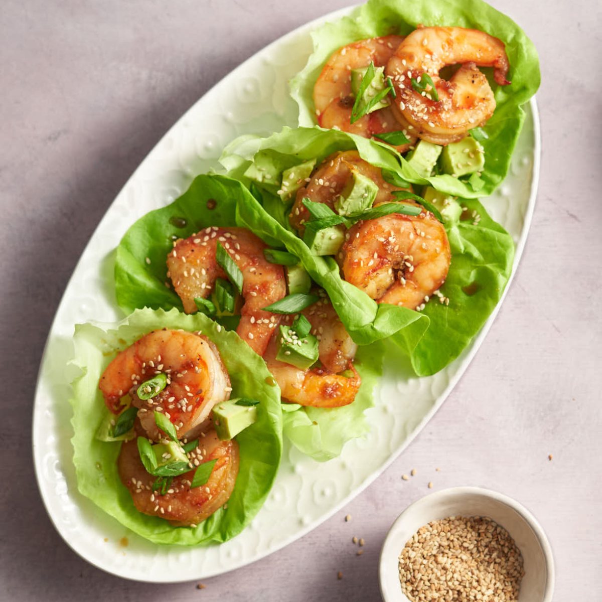 honey garlic shrimp lettuce wraps with fresh veggies.
