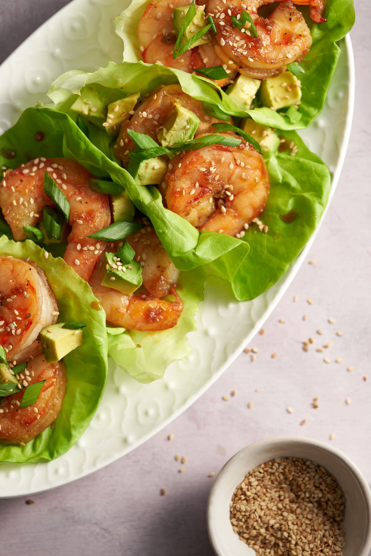 Honey garlic shrimp lettuce wraps with fresh vegetables and crispy lettuce.