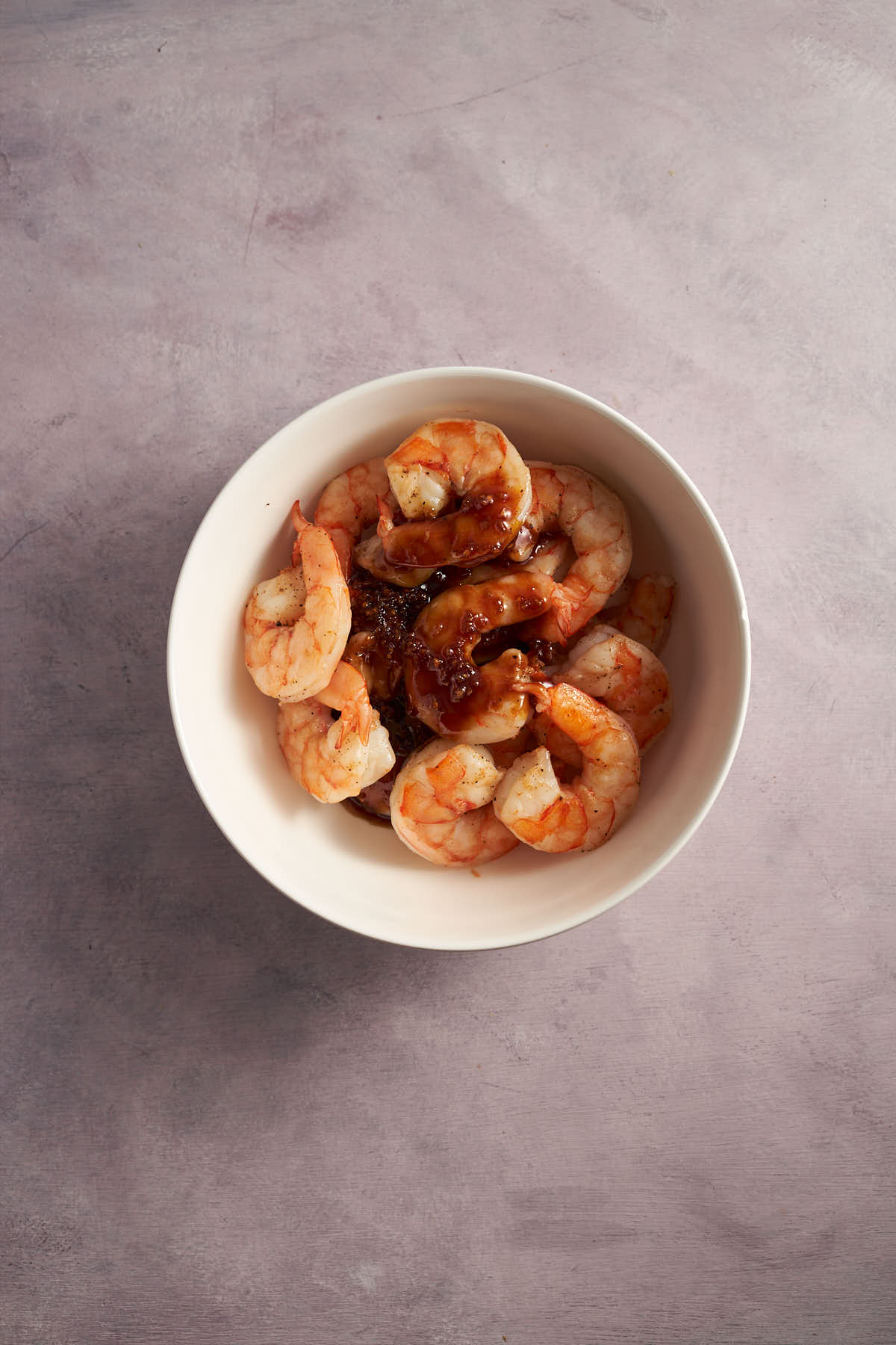 Air fryer shrimp coated in homemade honey garlic sauce.